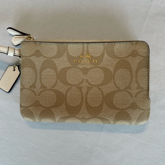Coach Signature Double Zipper Wristlet in Tan and White with gold trim. - Picture 2 of 5
